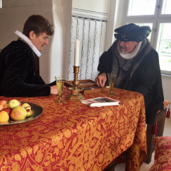gammel estrup praest og herremand ved daekket bord